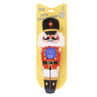 Load image into Gallery viewer, A Feline Frenzy Jolly Nutcracker toy in its original yellow blister packaging, featuring a nutcracker figure with a black hat, white beard, red coat, and blue badge on a white background.
