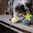 Load image into Gallery viewer, P.L.A.Y. Howling Haunts Colletion - Pup's Potion Toy on a wooden bench with dog nosing inside the cauldron
