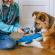 Load image into Gallery viewer, Dog mom sitting on hardwood floor with a dog, both interacting with Play's Ocean Buddies Big Blue and Baby Blue plush toy
