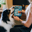Load image into Gallery viewer, Dog mom holding Play’s Party Animal Barkday Wishes birthday card with fluffy dog sniffing it in front of a desk indoors.
