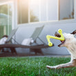 Load image into Gallery viewer, A dog playing with P.L.A.Y. ZoomieRex SuperZag Toy in green on the grass in a backyard
