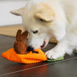 Load image into Gallery viewer, P.L.A.Y. Hippity Hoppity Collection - Funny Bunnies Toy underneath a fluffy white Corgi trying to pull the bunnies out

