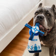 Load image into Gallery viewer, P.L.A.Y. Totally Touristy Dutch Windmill - medium size hanging out of big black dog's mouth sitting near a white bed
